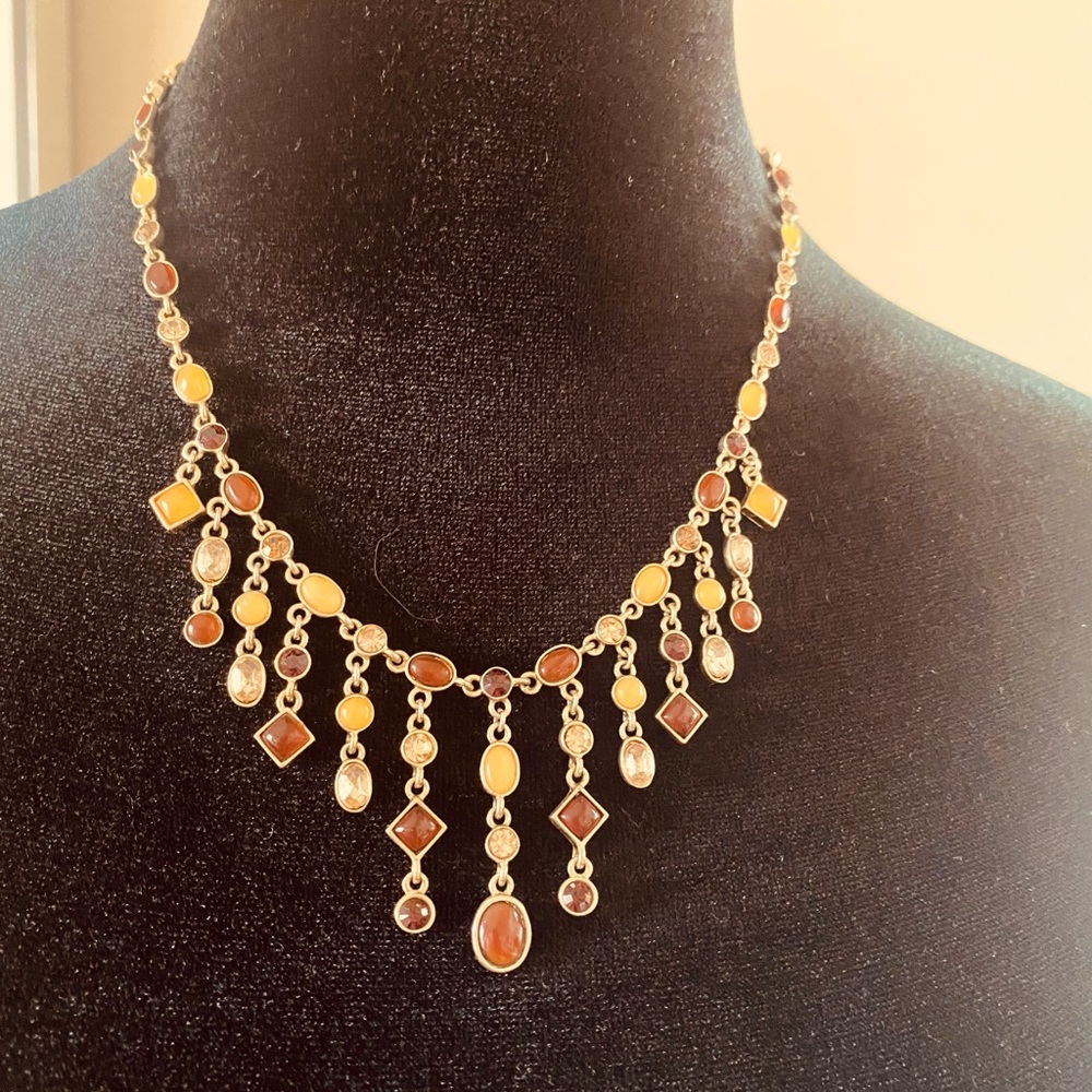 Necklace with gold, red, rust & clear stones. Adjustable length, lobster clasp